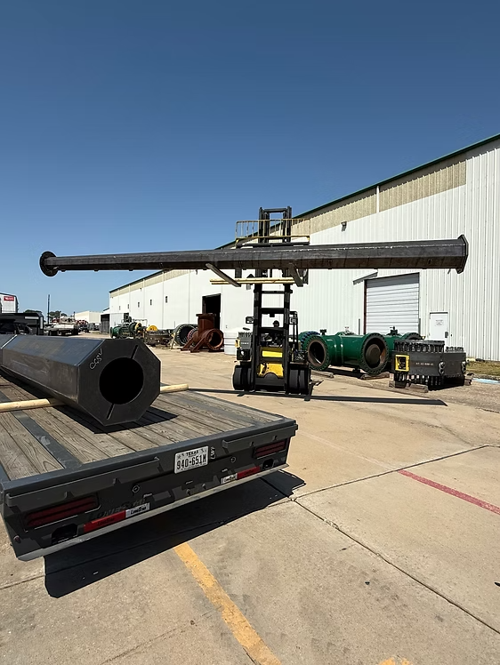 Galvanized substation steel structures secured on a flatbed trailer for delivery